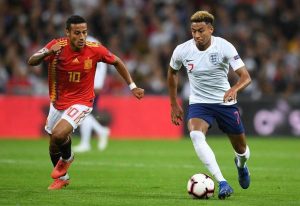 Jesse Lingard playing football against Spain