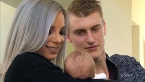 Sara Orlesky with her husband and child