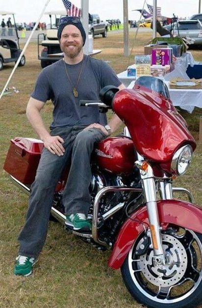 Molly Cookson's husband Ryan sitting in his bike