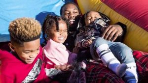 Kulture with her father and siblings