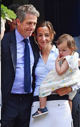 Anna with her husband and child