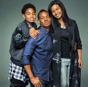 Amai with her brother and father