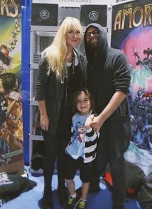 Chondra Echert with her husband Claudio Sanchez and a baby