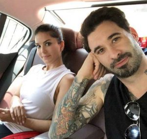 Daniel Weber with his wife, Sunny on his car