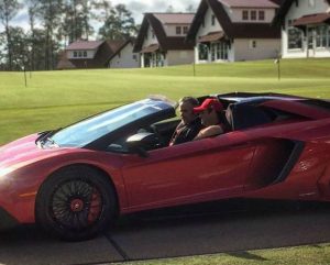 Patrick Reed on a car