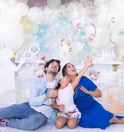 Karla Monroig with her husband and daughter