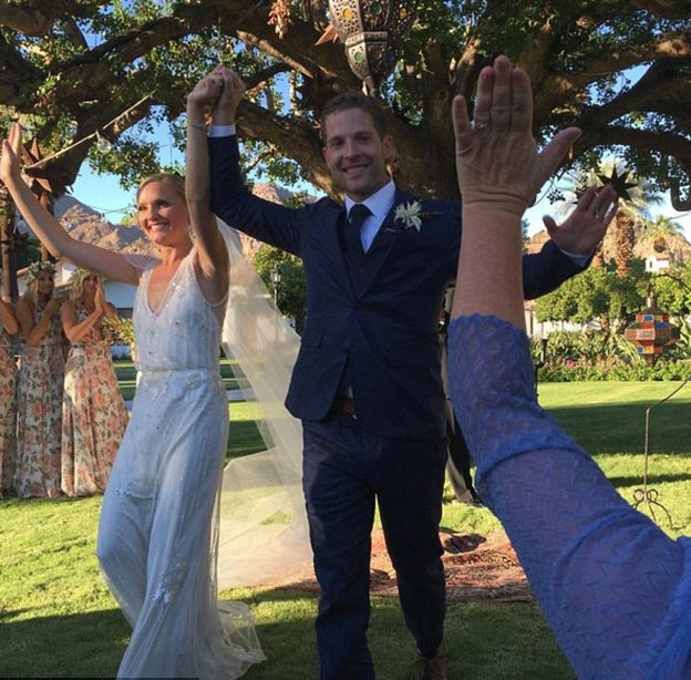 Kevin Simshauser with his wife Taylor in their wedding dress