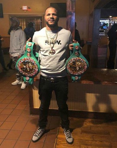 Anthony Dirrell showing his belts