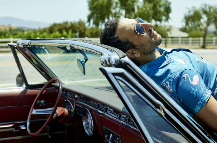 Desmin Borges posing with his car