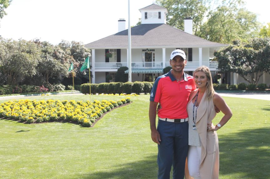 Jason Day in front of house with his wife