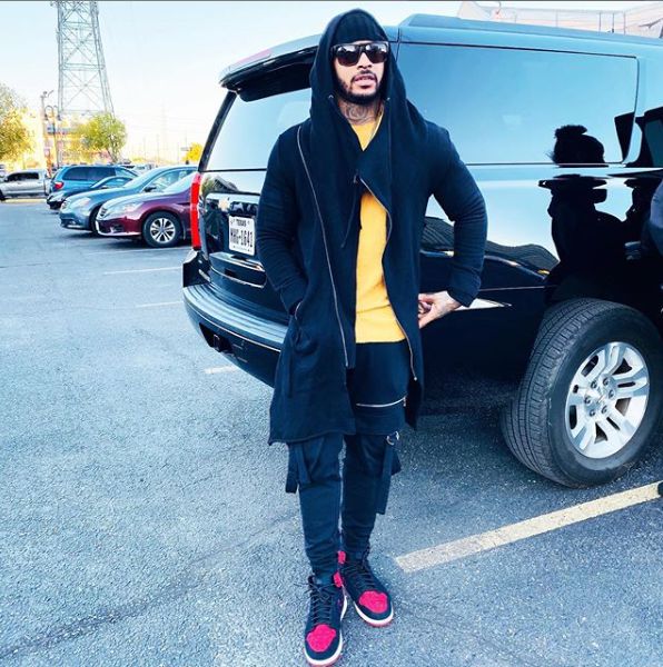 Ryan Henry in front of his car