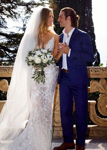 Birgen Anika Hartman with her husband in their wedding dress