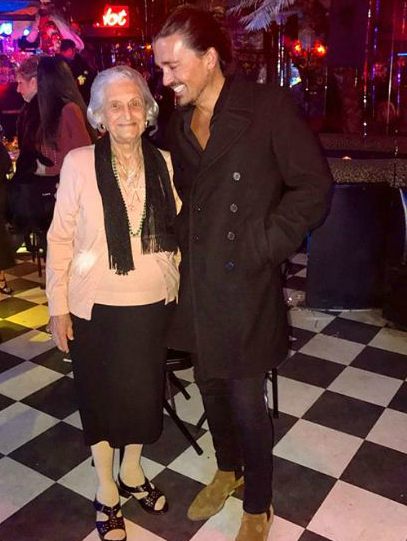 Sidney Torres with his grandmother, Lena Torres
