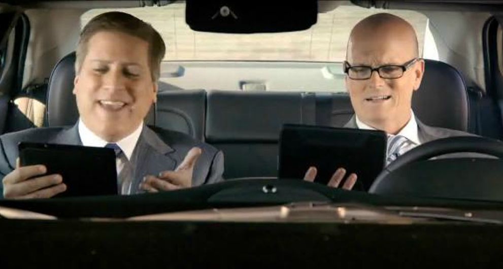 Scott Van Pelt with his co-host inside the car