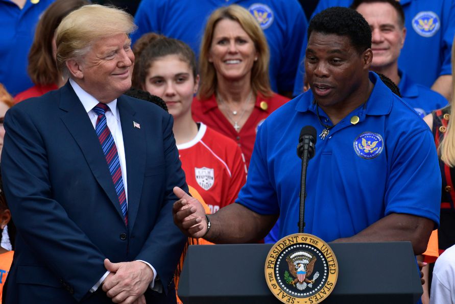 Herschel Walker giving speech in front of Trump