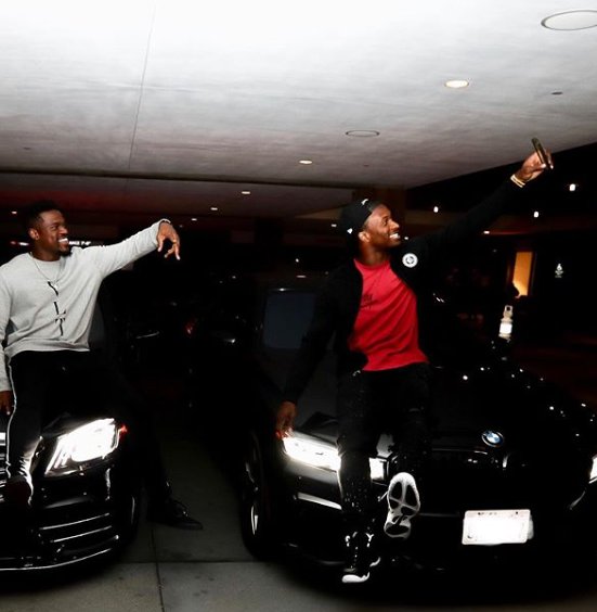 Todd Gurley taking selfie with his friends siting in car