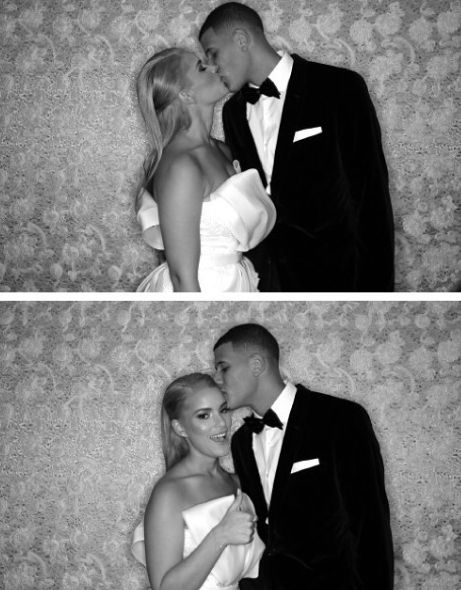 Manny Machado kissing his wife in their wedding dress