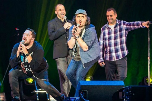 Brian Quinn with his comedy troupe performing on the stage
