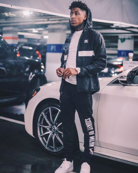 Kayden Gaulden's father, Kentrell DeSean Gaulden posing with his car