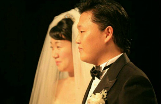 Yoo Hye Yeon with her husband, Psy on their wedding day
