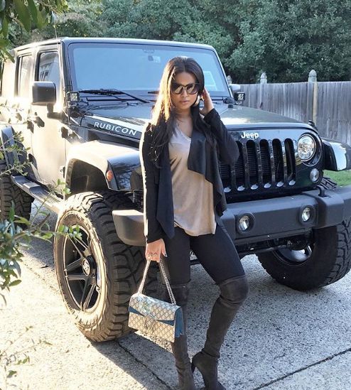 Natasha Sen standing in front of her Jeep