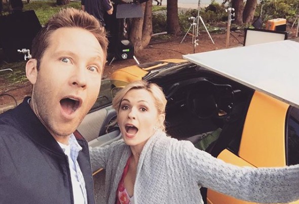 Lindsey Gort clicking selfie with her co-actor in front of car