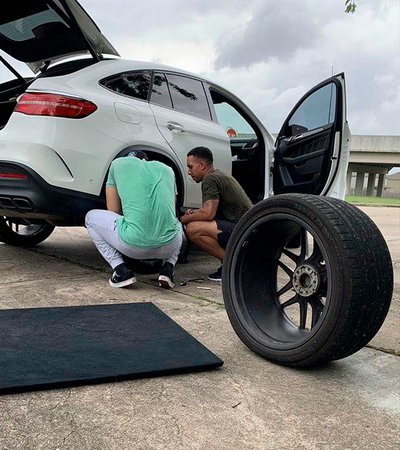 Melissa Brantley's husband with his friends repairing his car