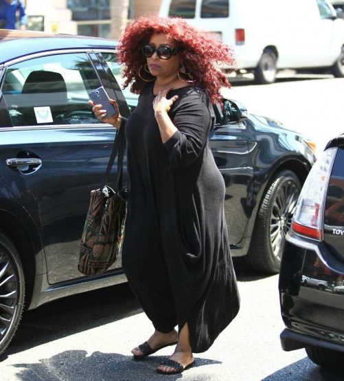 Doug Rasheed's wife Chaka in front of her car