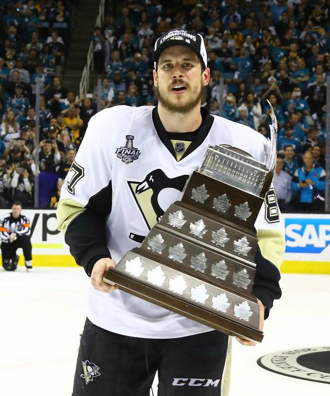 Sidney Crosby holding his award. 