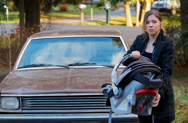 Jennette Mccurdy posing with her car