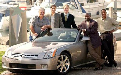 Emmitt Smith with his friends standing outside car 