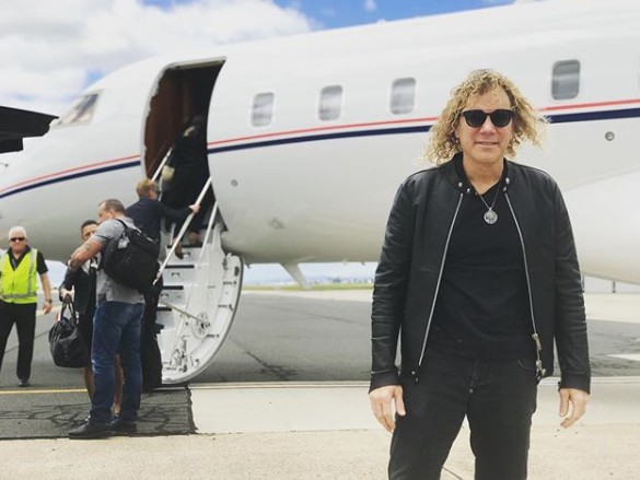 David Bryan travelling through airplane