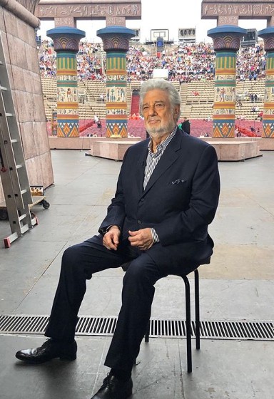 Placido Domingo sitting in chair