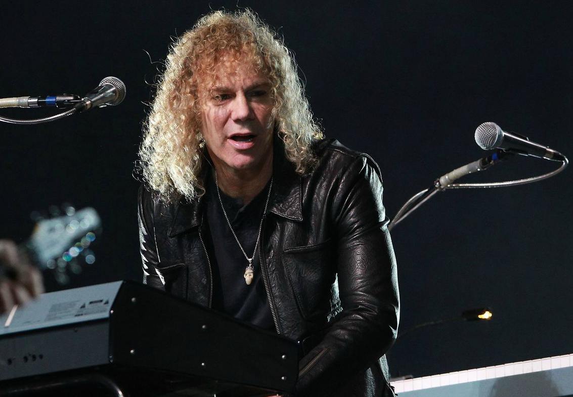 David Bryan in a concert with his band & playing keywords