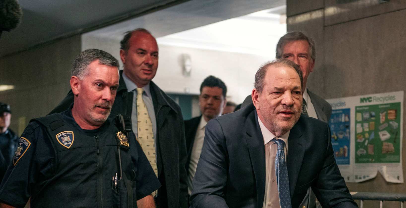 Movie producer Harvey Weinstein (R) enters New York City Criminal Court on February 24, 2020 in New York City
