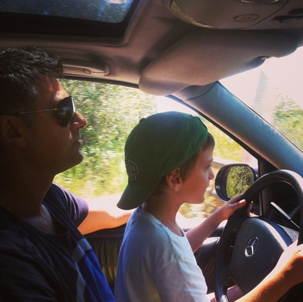 Gjin Lipa learning to ride a car with his father