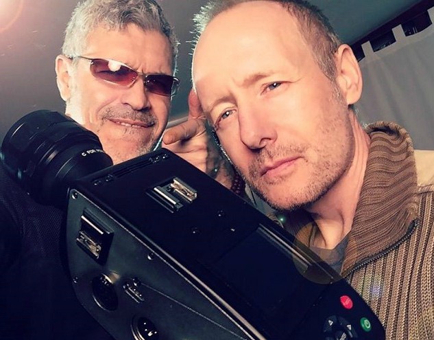 Bert Kish with his assistance posing for a photo