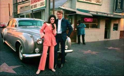 Sarah Barg's ex-husband Glen posing for photo with co-star in front of car