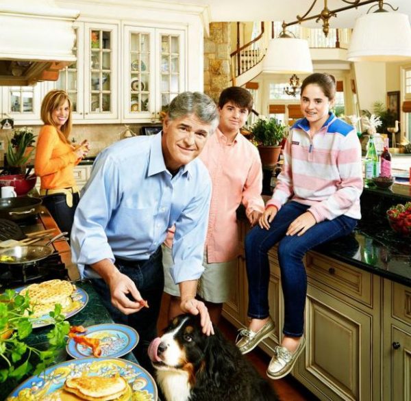 Jill Rhodes with her husband Sean & kids inside their house