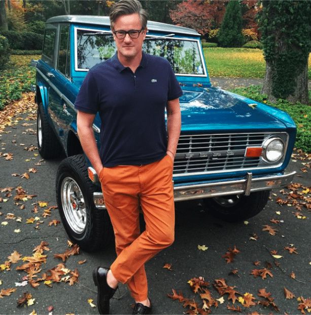 Waren's ex-husband Joe posing for photo with his classic car