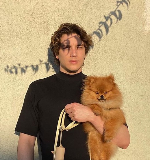 Cody Fern clicking picture with his dog