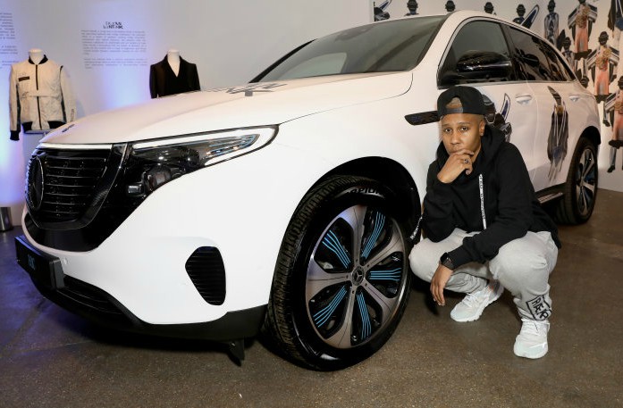 Lena Waithe posing for photo with her car