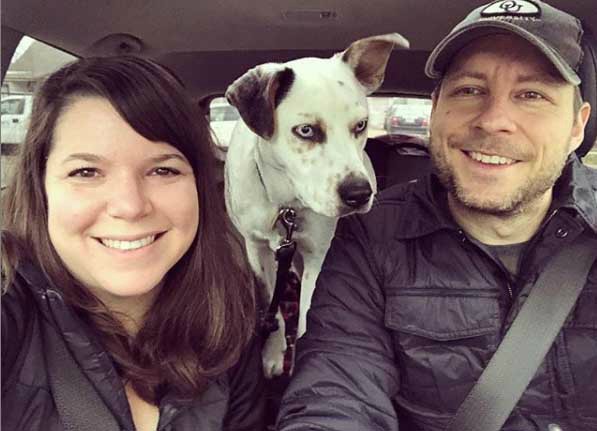 Ellen Hamilton Latzen clicks a selfie while her boyfriend and dog are in the car