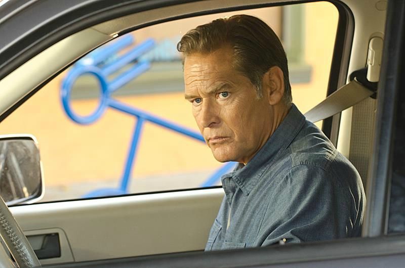 Atsuko Remar's husband sitting inside his car
