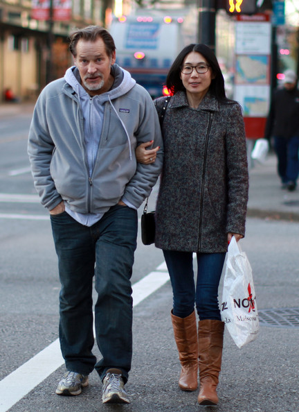 Atsuko Remar walking holding the hand of her husband James