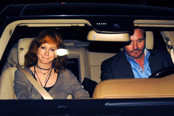 Laura Stroud's Laura Stroud's ex-boyfriend Narvel with his ex-wife Reba sitting inside their car