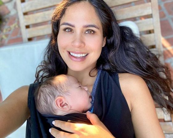 Kimberly Snyder clicking selfie with her son