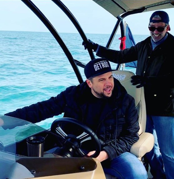 Jay Towers riding a boat 
