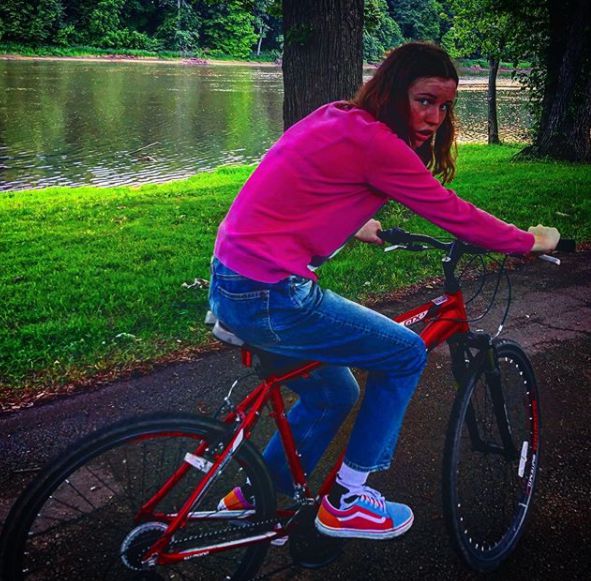 Claire Drake riding the bicycle