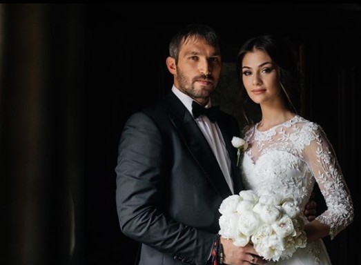 Anastasia Shubskaya with her husband Alexander Ovechkin in their wedding dress 